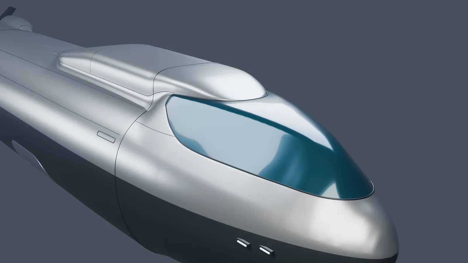 The smooth grey forebody of the carrier with its long bridge window.